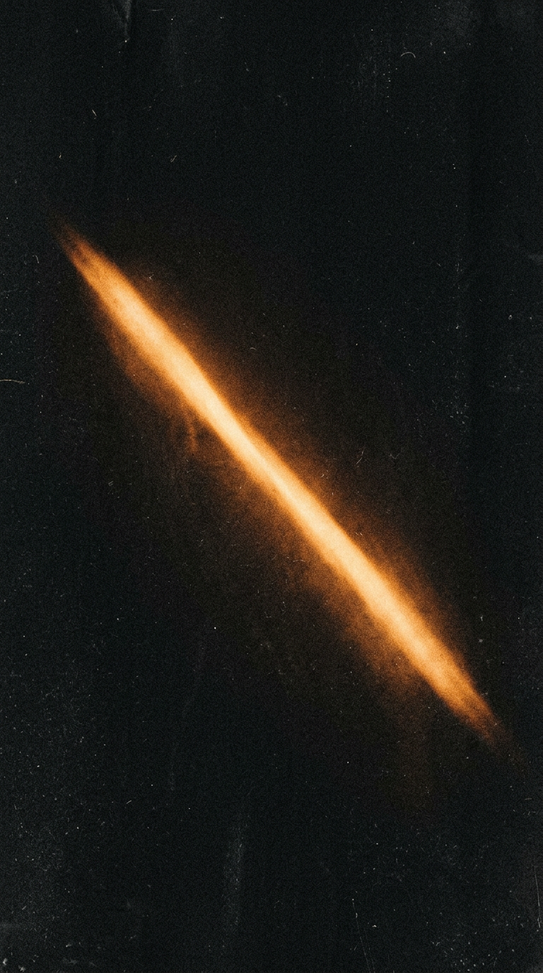 A streak of amber light cuts across a dark, grainy field — a film still.